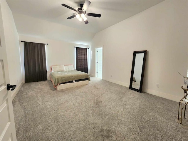 bedroom featuring carpet flooring, vaulted ceiling, and ceiling fan