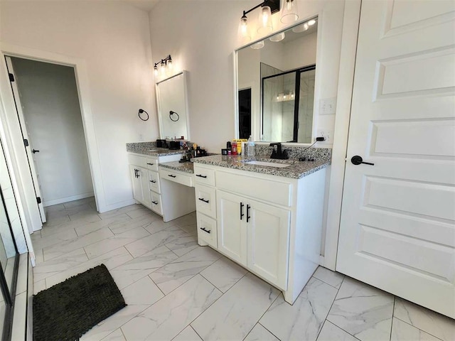 bathroom with vanity and an enclosed shower