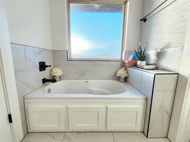 bathroom with a tub to relax in