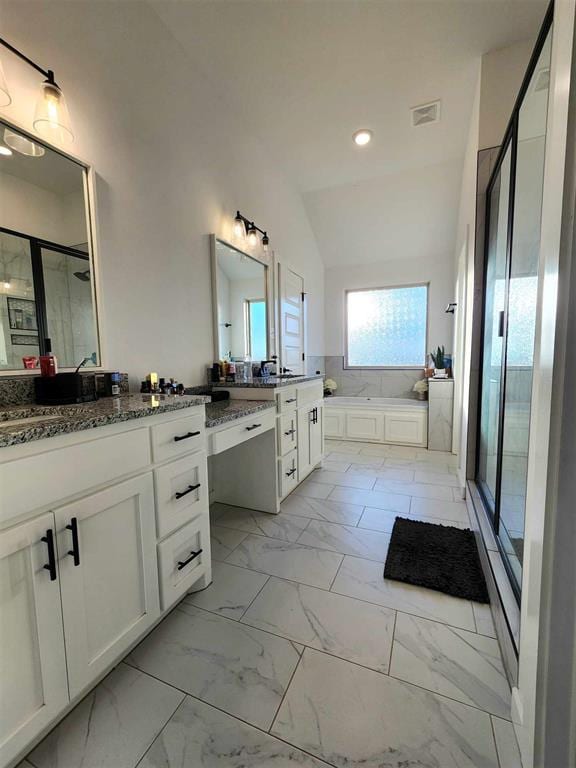 bathroom featuring vanity, lofted ceiling, and plus walk in shower