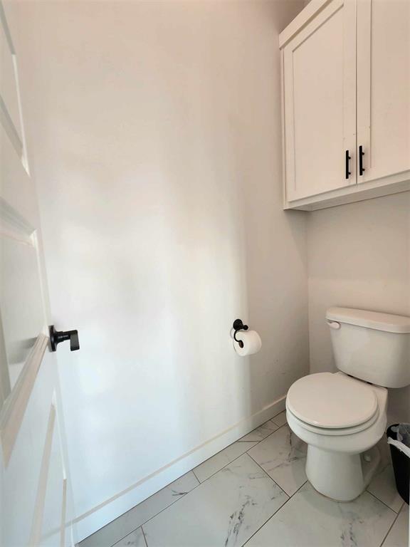 bathroom featuring toilet