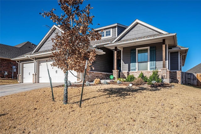 craftsman house with a porch and a garage