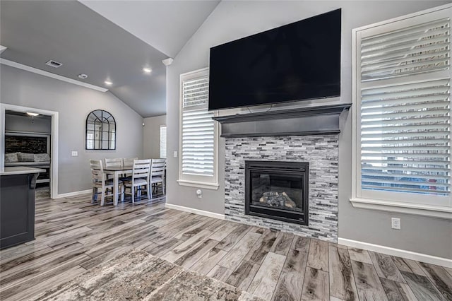 unfurnished living room with lofted ceiling and a fireplace