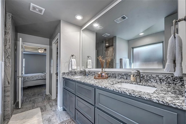 bathroom featuring vanity and ceiling fan