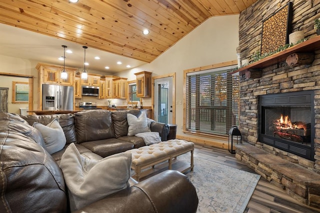 living room featuring hardwood / wood-style flooring, a stone fireplace, wood ceiling, and high vaulted ceiling