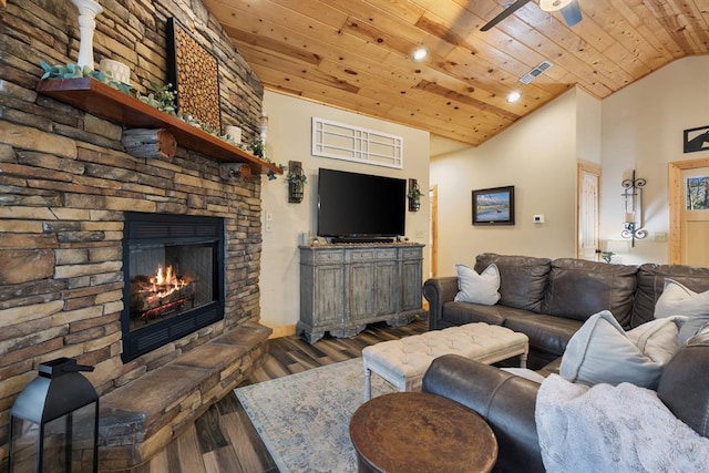 living room featuring wood ceiling, vaulted ceiling, ceiling fan, a fireplace, and dark hardwood / wood-style floors