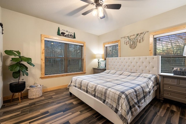 bedroom with ceiling fan and dark hardwood / wood-style floors