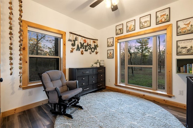 sitting room with wood-type flooring and ceiling fan