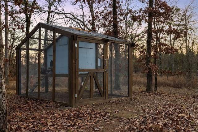 view of outdoor structure at dusk