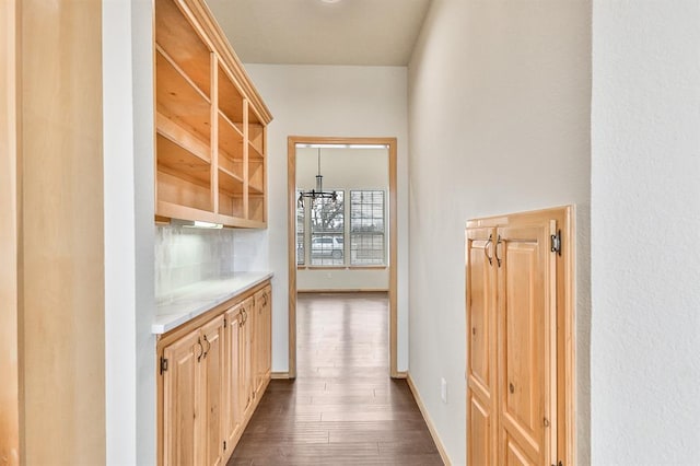 interior space with dark wood-style floors and baseboards