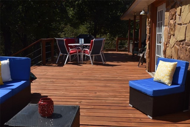 wooden deck with an outdoor hangout area