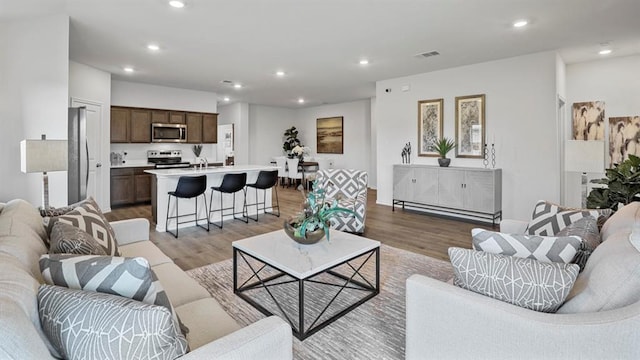 living room with light hardwood / wood-style floors