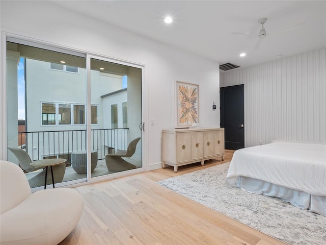 bedroom featuring access to exterior, ceiling fan, and light hardwood / wood-style floors