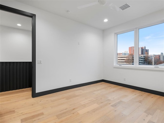 spare room with light hardwood / wood-style floors