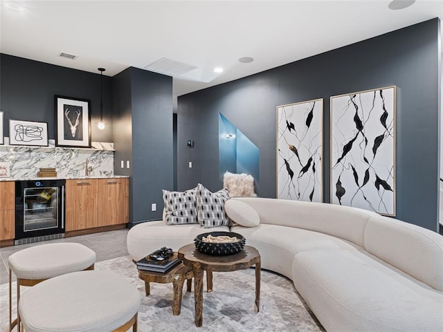 living room with beverage cooler and indoor bar