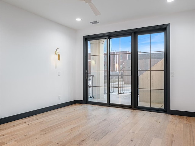 unfurnished room featuring ceiling fan and light hardwood / wood-style flooring