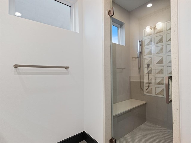 bathroom with a tile shower