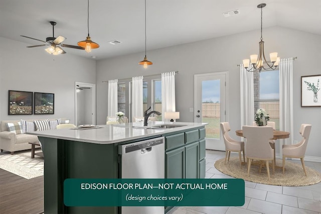 kitchen featuring dishwasher, sink, hanging light fixtures, an island with sink, and ceiling fan with notable chandelier