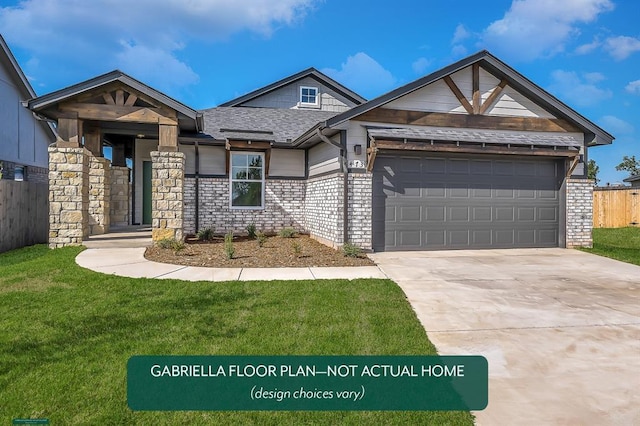 view of front of house with a garage and a front lawn