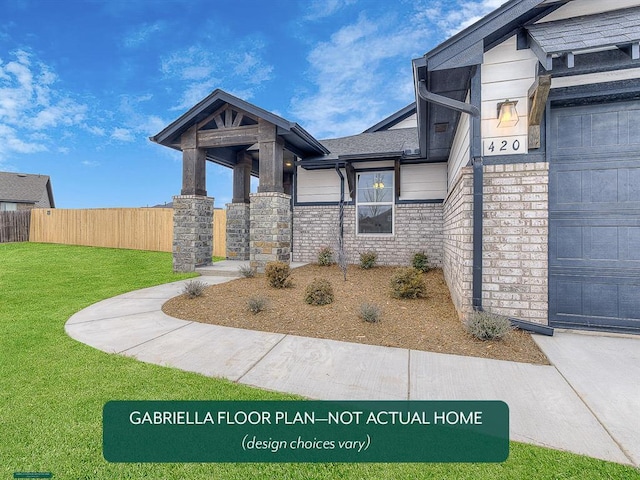 exterior space featuring a garage and a front lawn