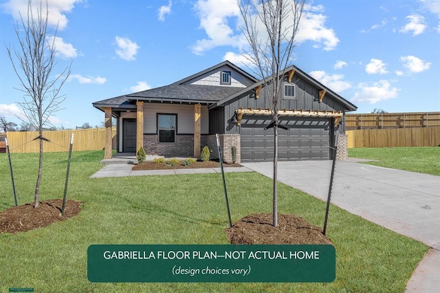 view of front of house with a garage and a front lawn