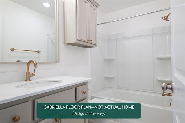 bathroom featuring washtub / shower combination and vanity