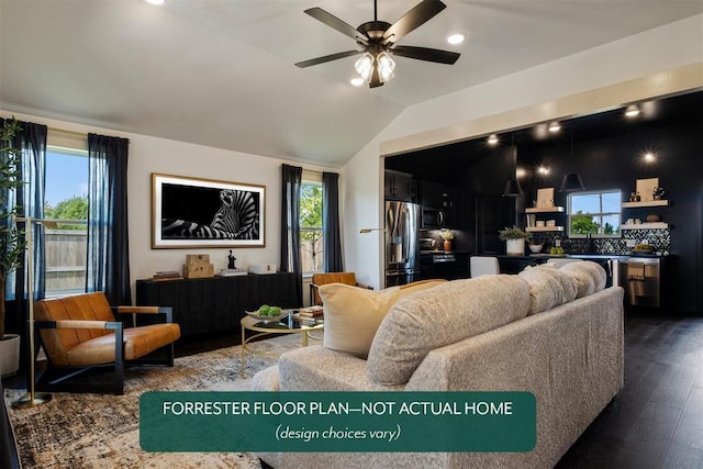 living room with hardwood / wood-style floors, ceiling fan, and lofted ceiling