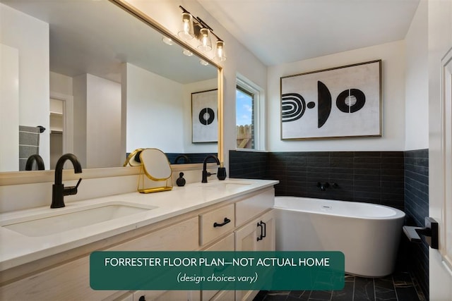 bathroom featuring a bathing tub, vanity, and tile walls