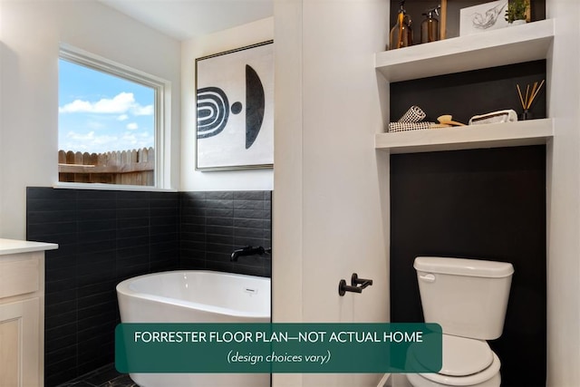 bathroom featuring vanity, toilet, tile walls, and a tub