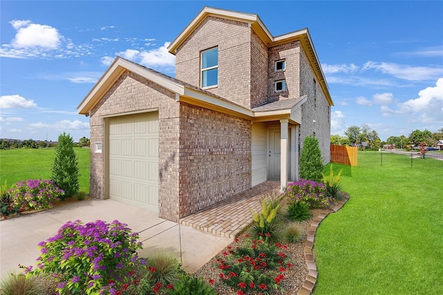 view of front of house with a front yard and a garage