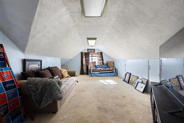 bonus room with carpet flooring, a textured ceiling, and lofted ceiling