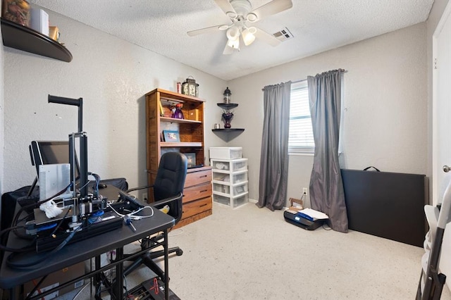 office area featuring ceiling fan and a textured ceiling