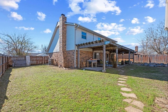 back of house featuring central air condition unit, a patio area, and a lawn