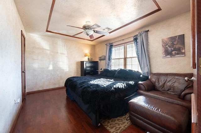 bedroom featuring ceiling fan and dark wood-type flooring