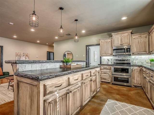 kitchen with a kitchen bar, stainless steel appliances, light brown cabinets, pendant lighting, and a kitchen island