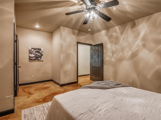 carpeted bedroom featuring ceiling fan