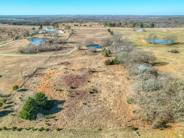 bird's eye view featuring a rural view and a water view