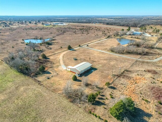 aerial view with a rural view and a water view