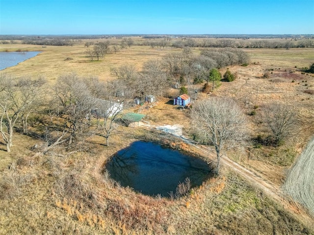 drone / aerial view featuring a water view and a rural view