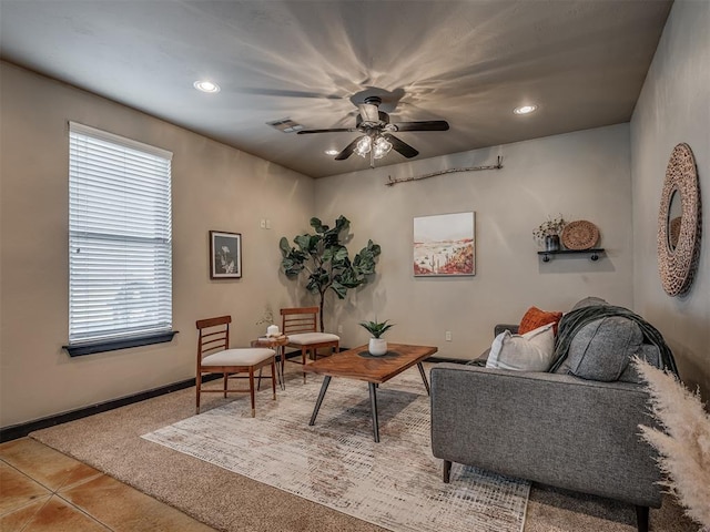 living area with tile patterned flooring, recessed lighting, visible vents, baseboards, and a ceiling fan