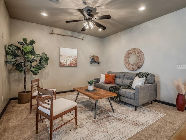 living room with recessed lighting, light colored carpet, ceiling fan, and baseboards