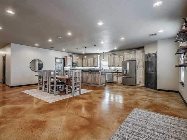 dining room featuring visible vents, baseboards, concrete flooring, and recessed lighting