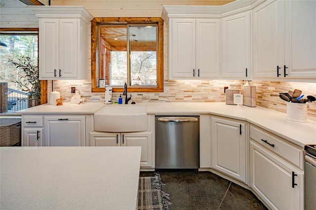 kitchen with stainless steel dishwasher, white cabinets, and sink