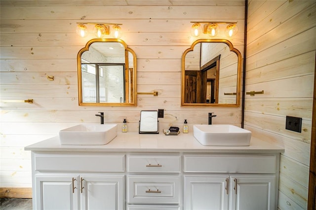 bathroom with vanity and wooden walls