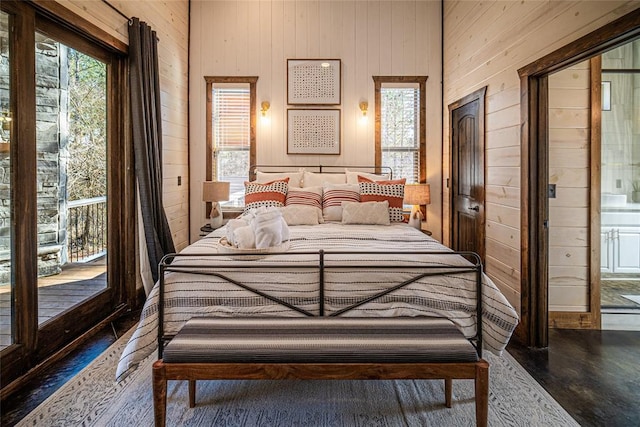 bedroom featuring wooden walls and dark wood-type flooring