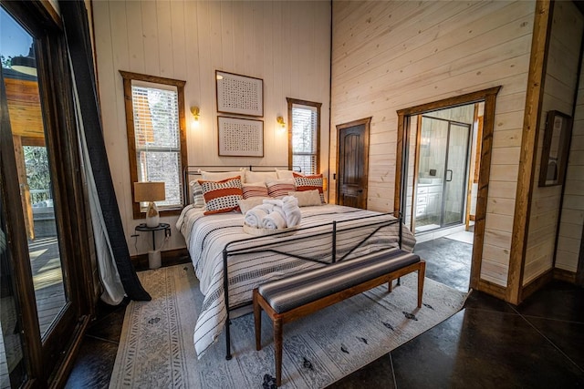 bedroom with wooden walls and a high ceiling