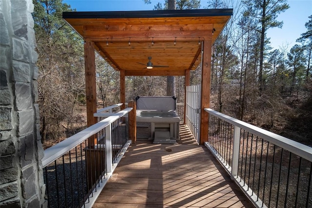 wooden terrace featuring ceiling fan