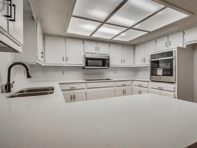 kitchen featuring white cabinets, sink, and stainless steel appliances