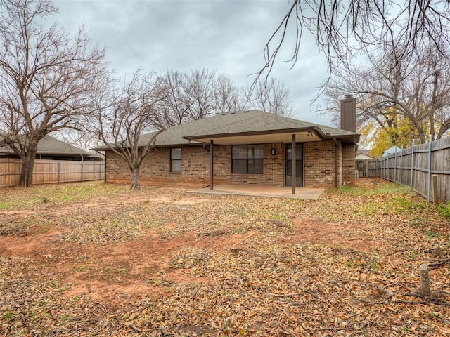 rear view of property featuring a patio