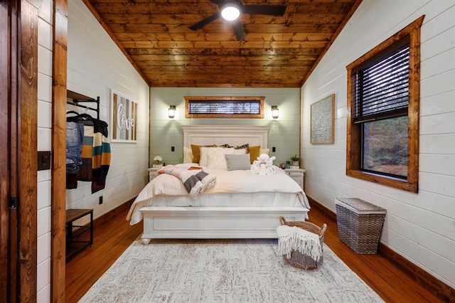 bedroom with ceiling fan, light hardwood / wood-style floors, wooden ceiling, and vaulted ceiling